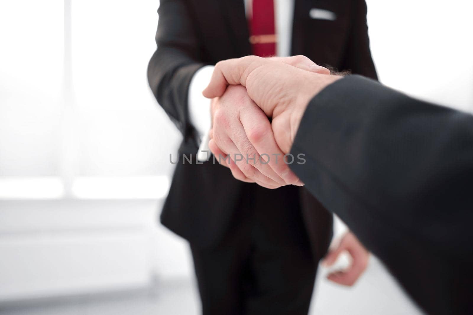 close up.handshake business partners. by asdf