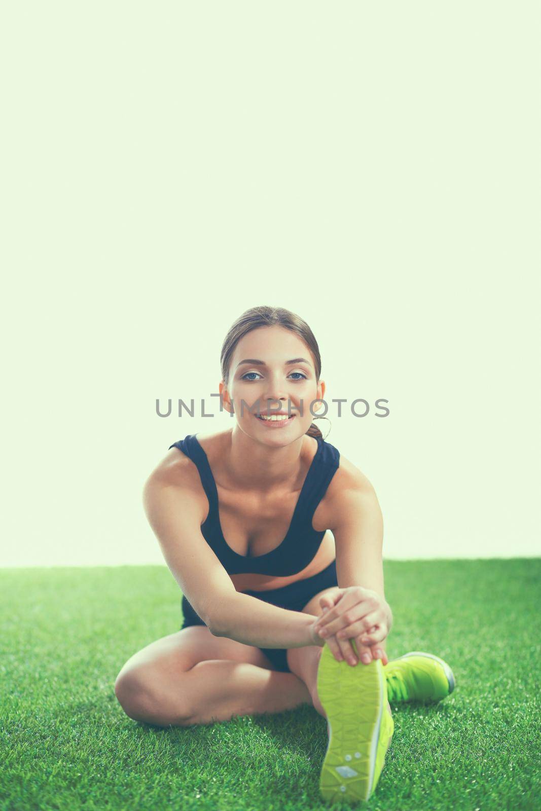 Portrait of sport girl doing stretching exercise.