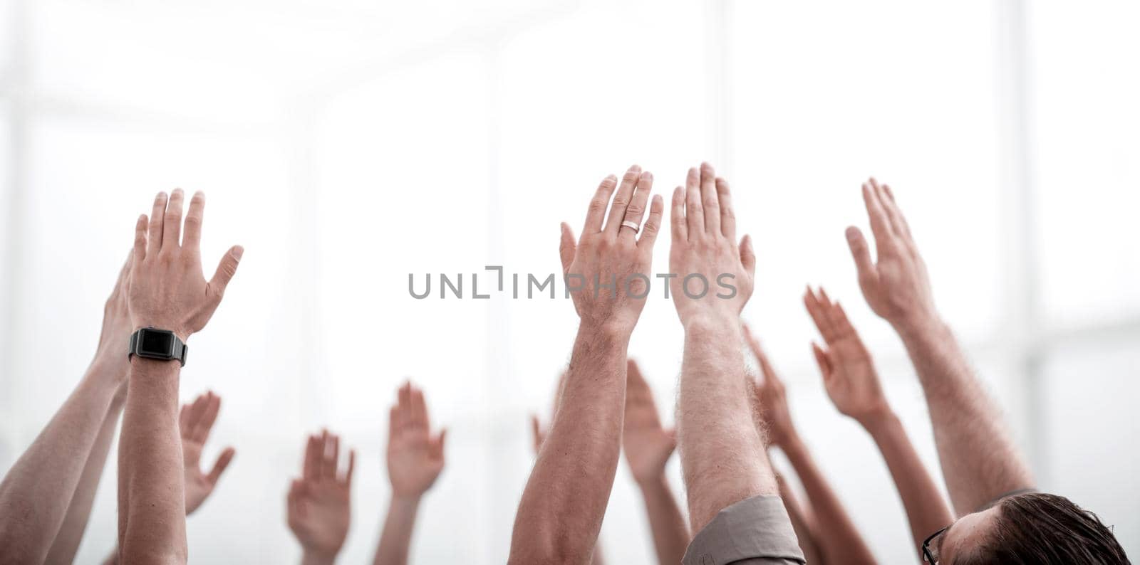business background.the business team stands with their hands up by asdf