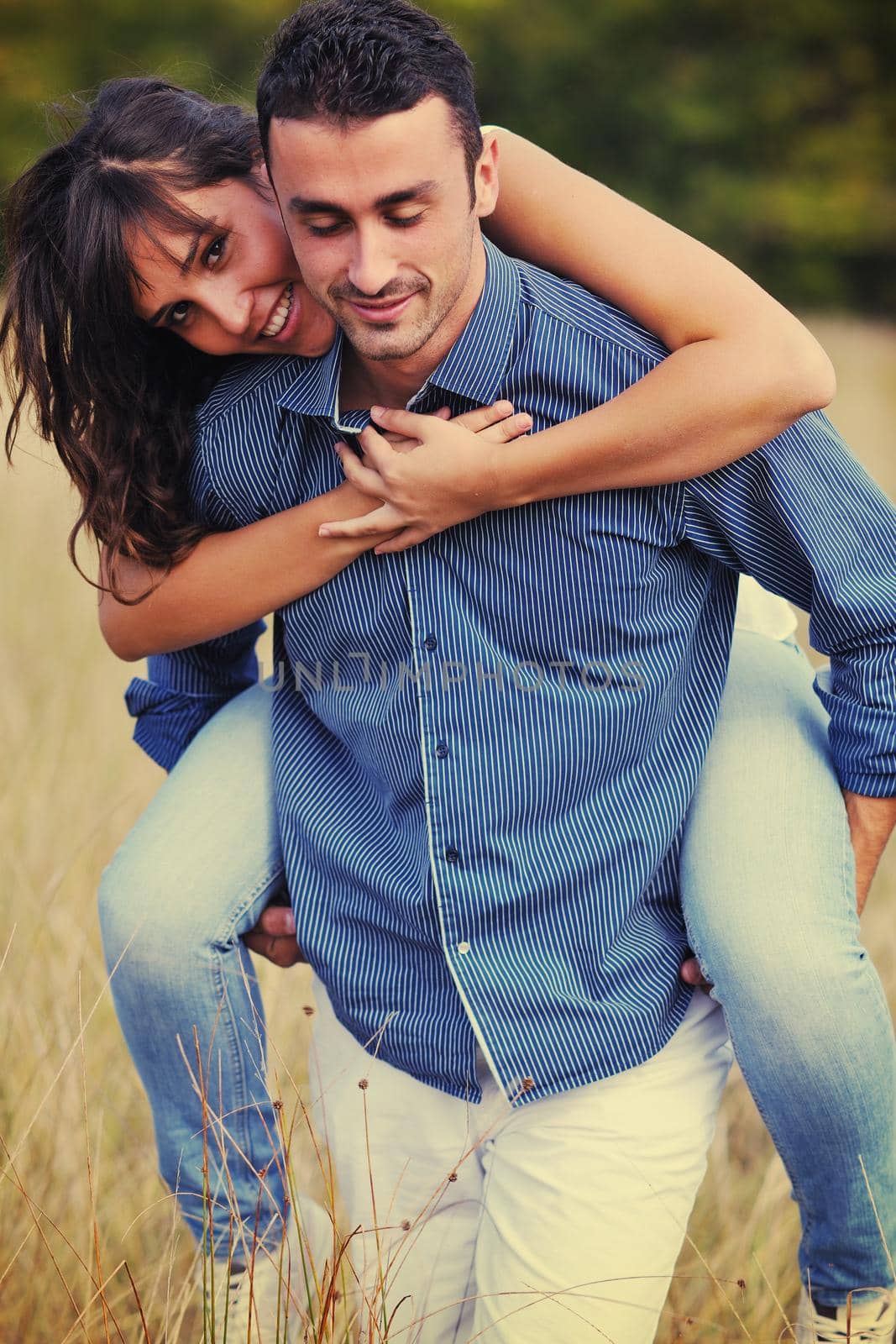 happy young couple have romantic time outdoor while smiling and hug