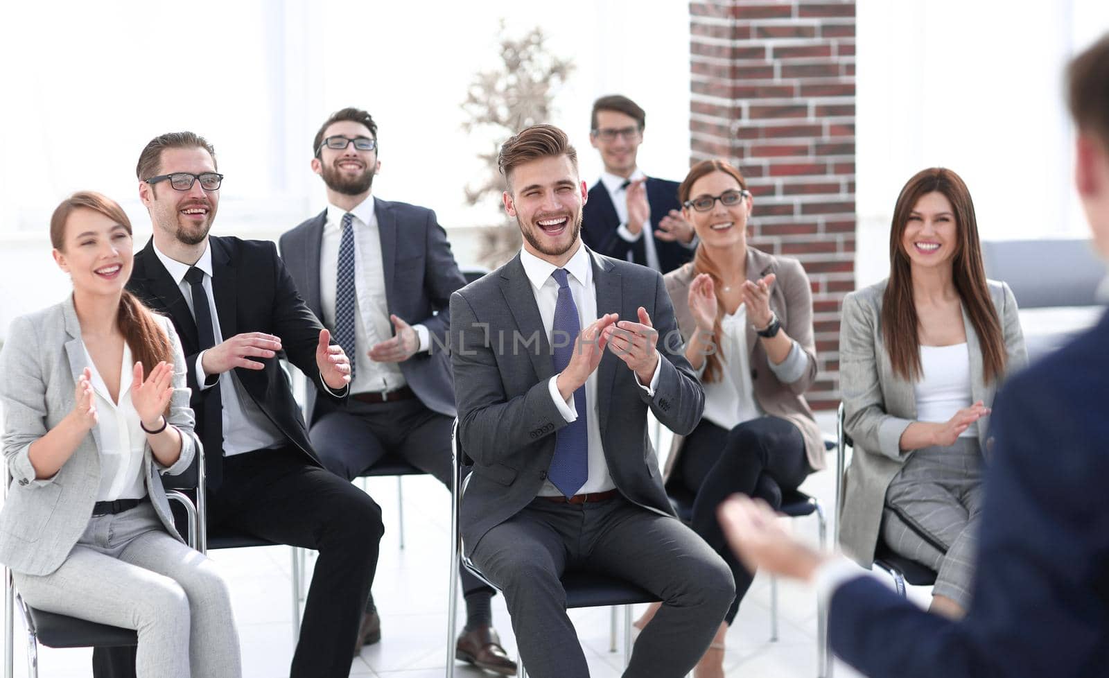 business team applauds the speaker at a business meeting by asdf