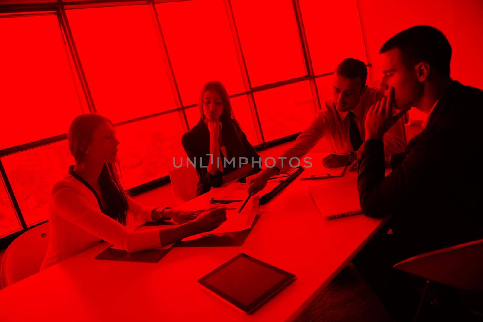 Group of happy young  business people in a meeting at office