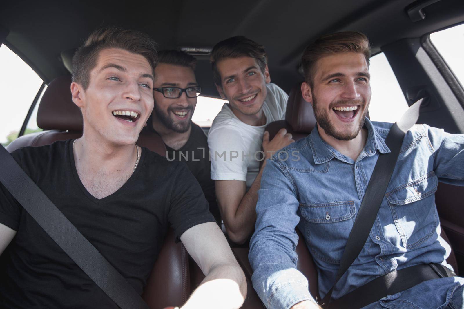 close up. three friends travel in a car by asdf