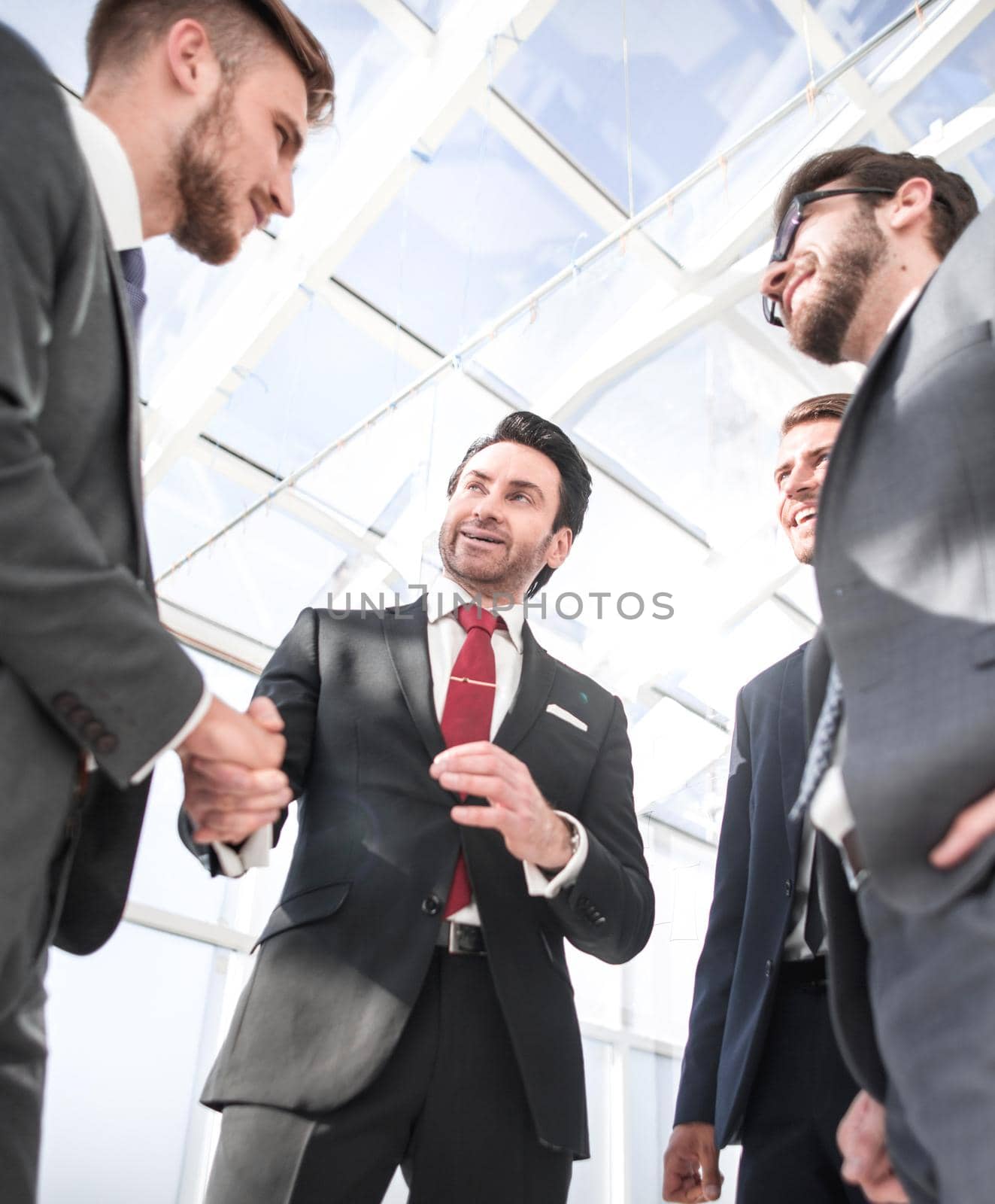 handshake business partners standing in the office.business concept