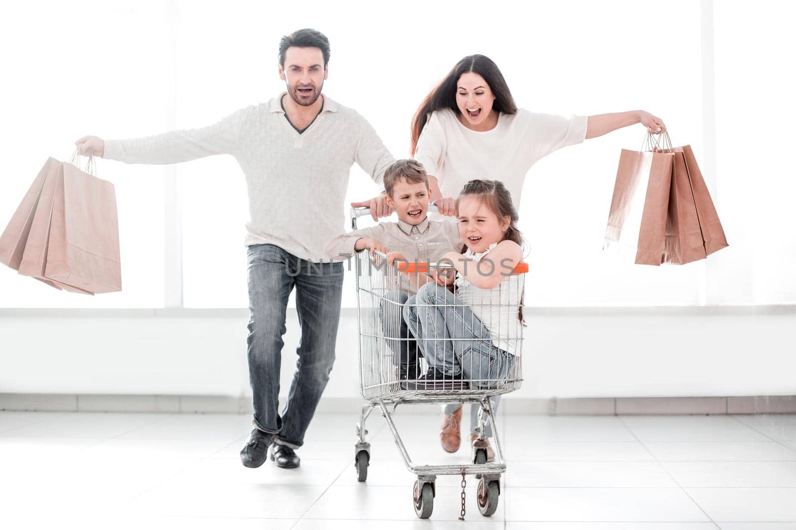 happy parents with children go shopping by asdf