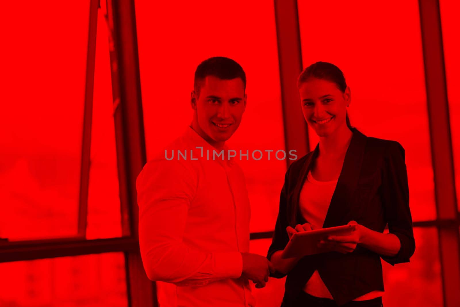 Group of happy young  business people in a meeting at office