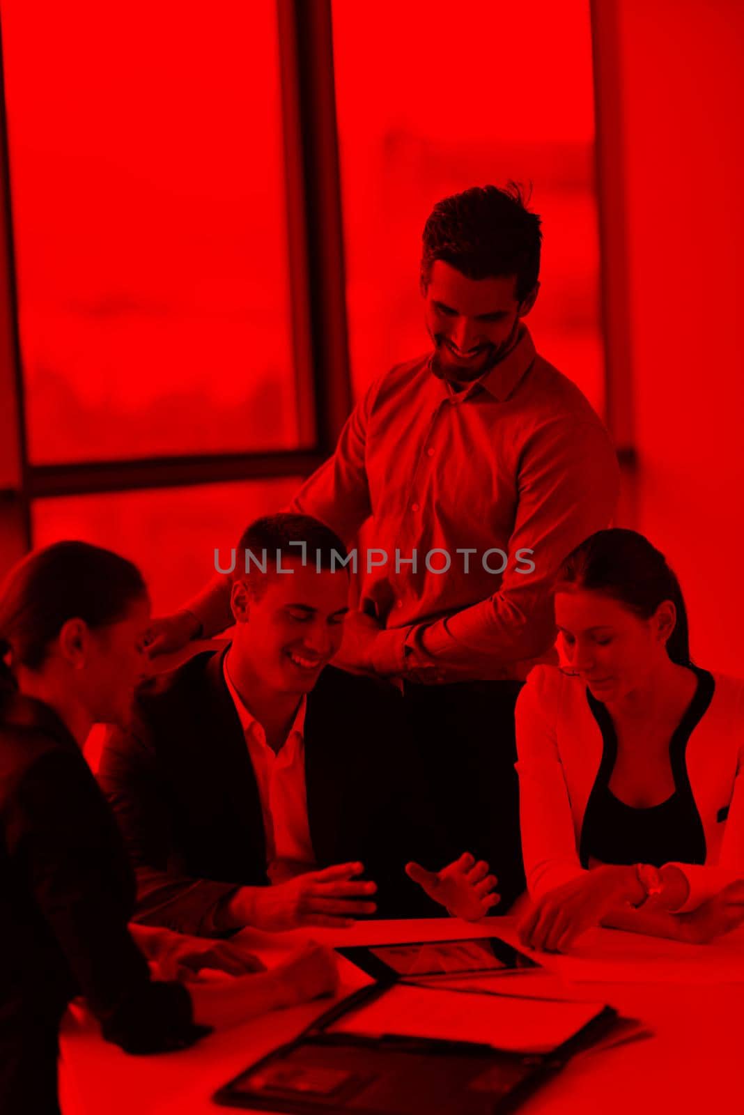 Group of happy young  business people in a meeting at office