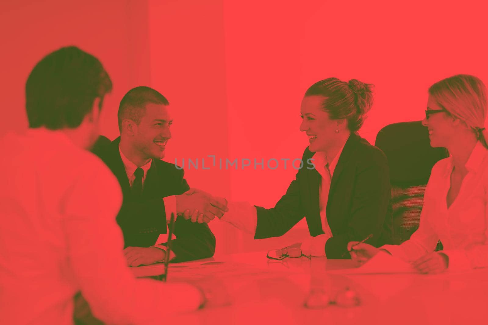 Group of happy young  business people in a meeting at office