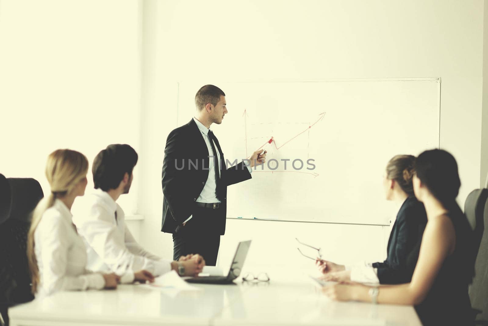 Group of happy young  business people in a meeting at office