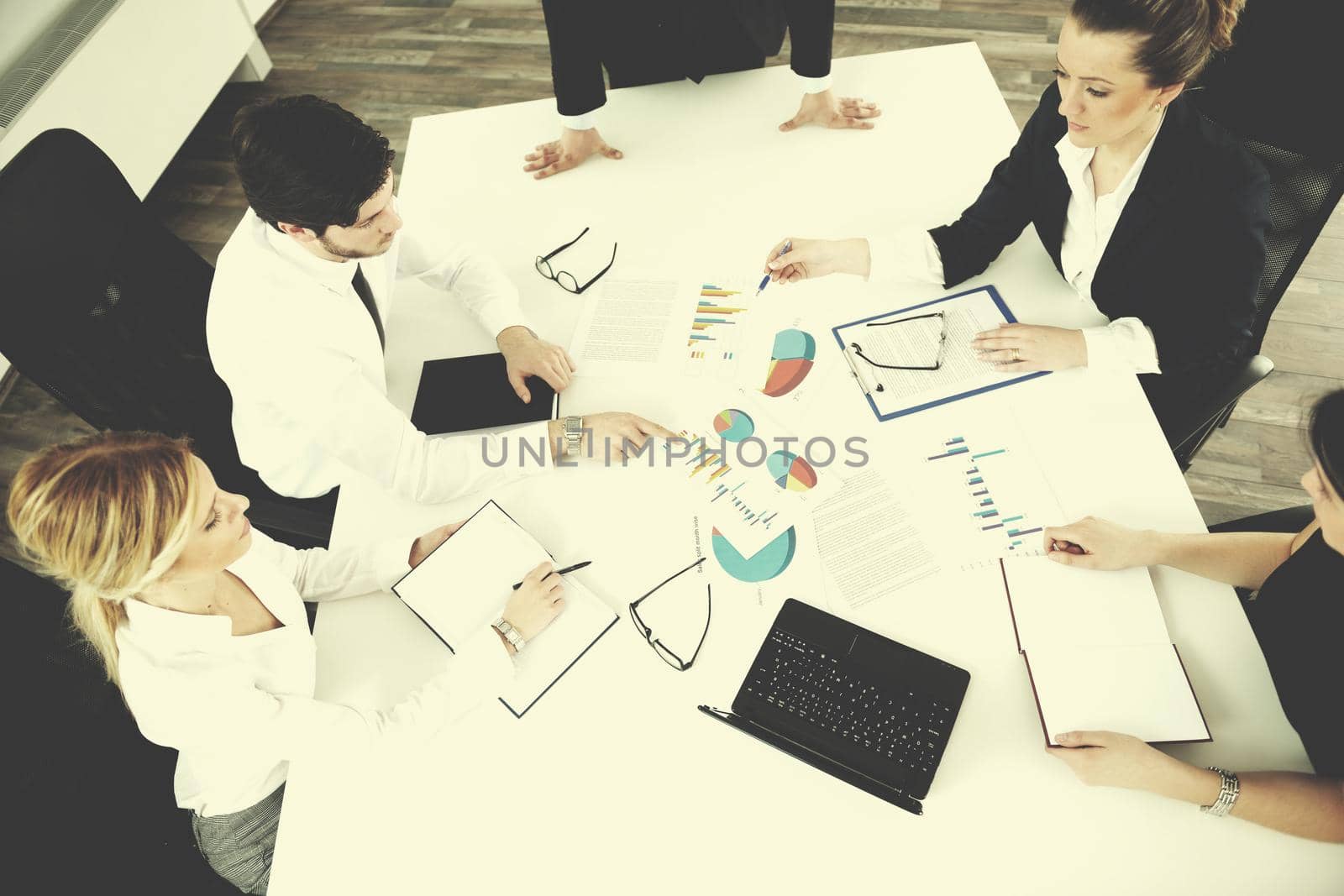 Group of happy young  business people in a meeting at office