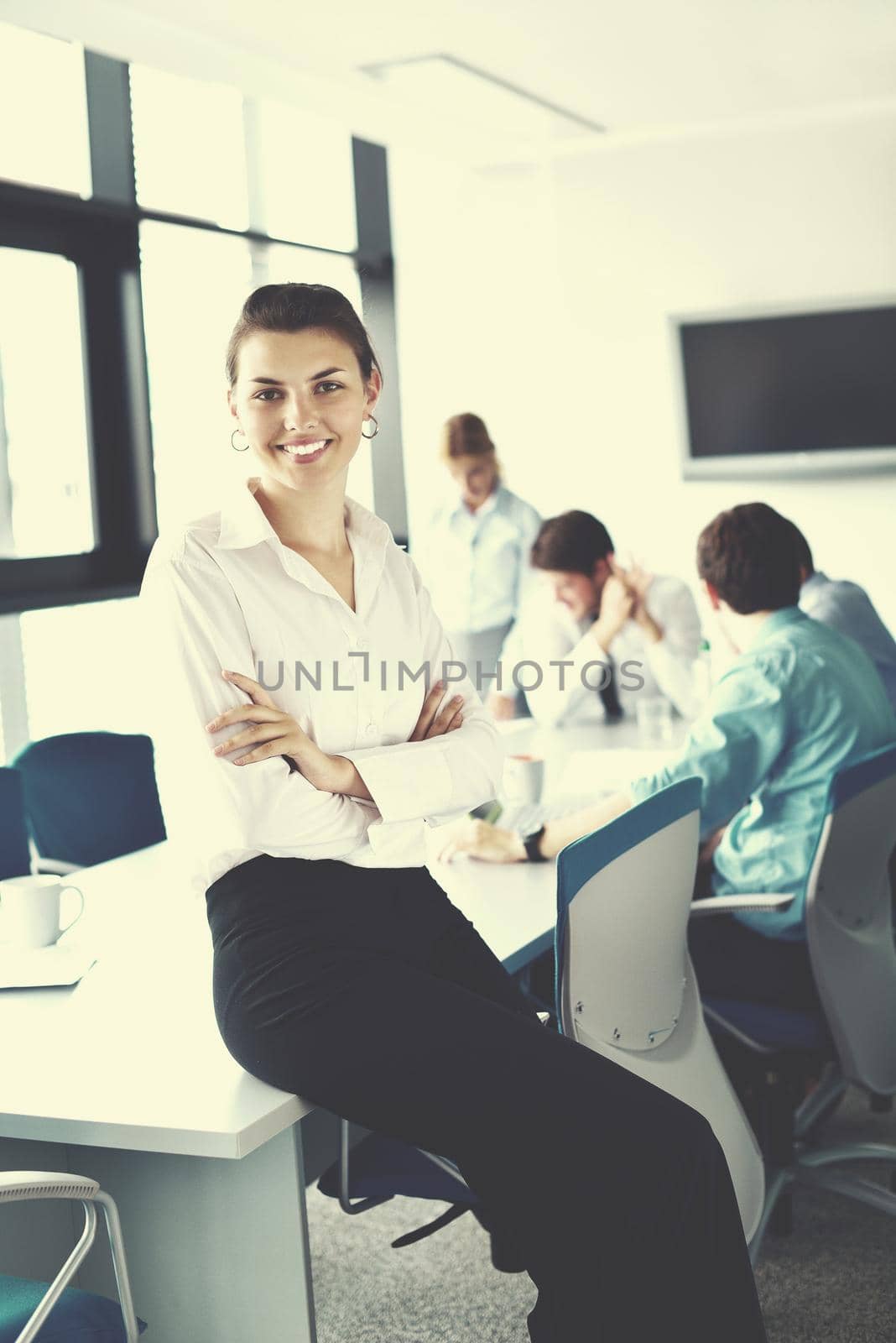 business woman  with her staff,  people group in background at modern bright office indoors