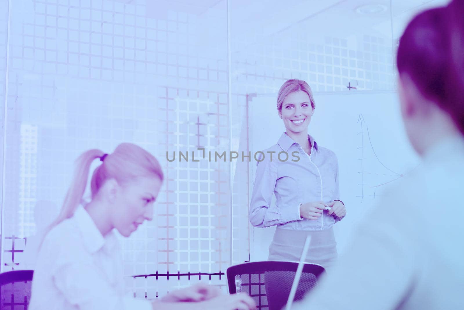 Group of happy young  business people in a meeting at office