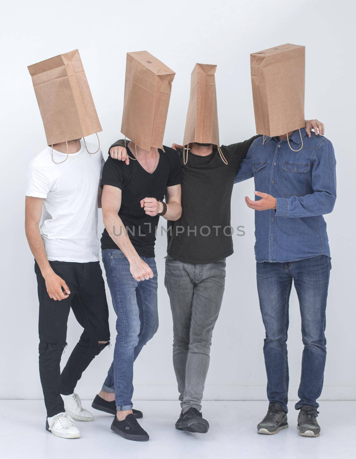 group of men with paper bags on their heads by asdf