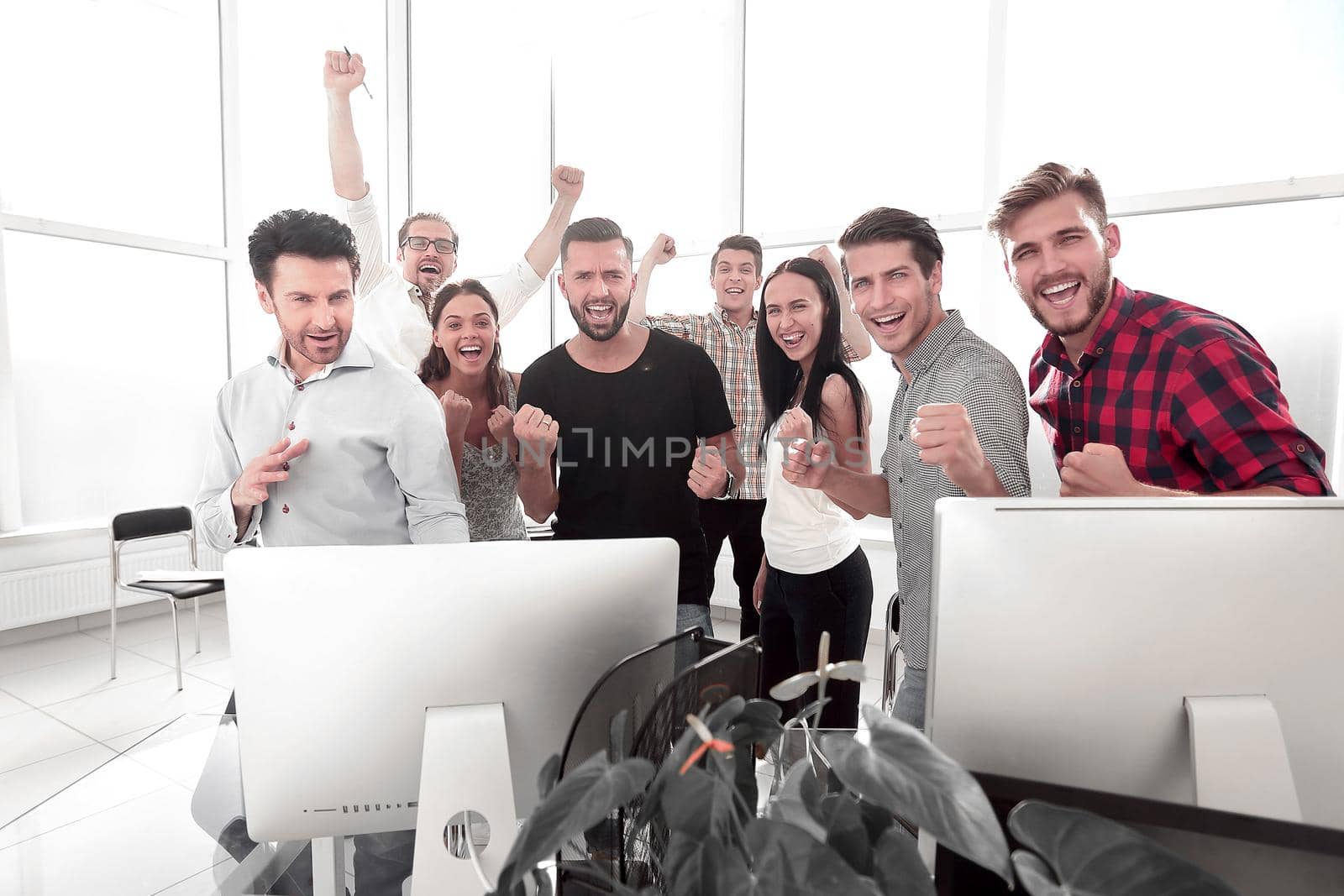 happy professional business team standing in modern office.photo with copy space