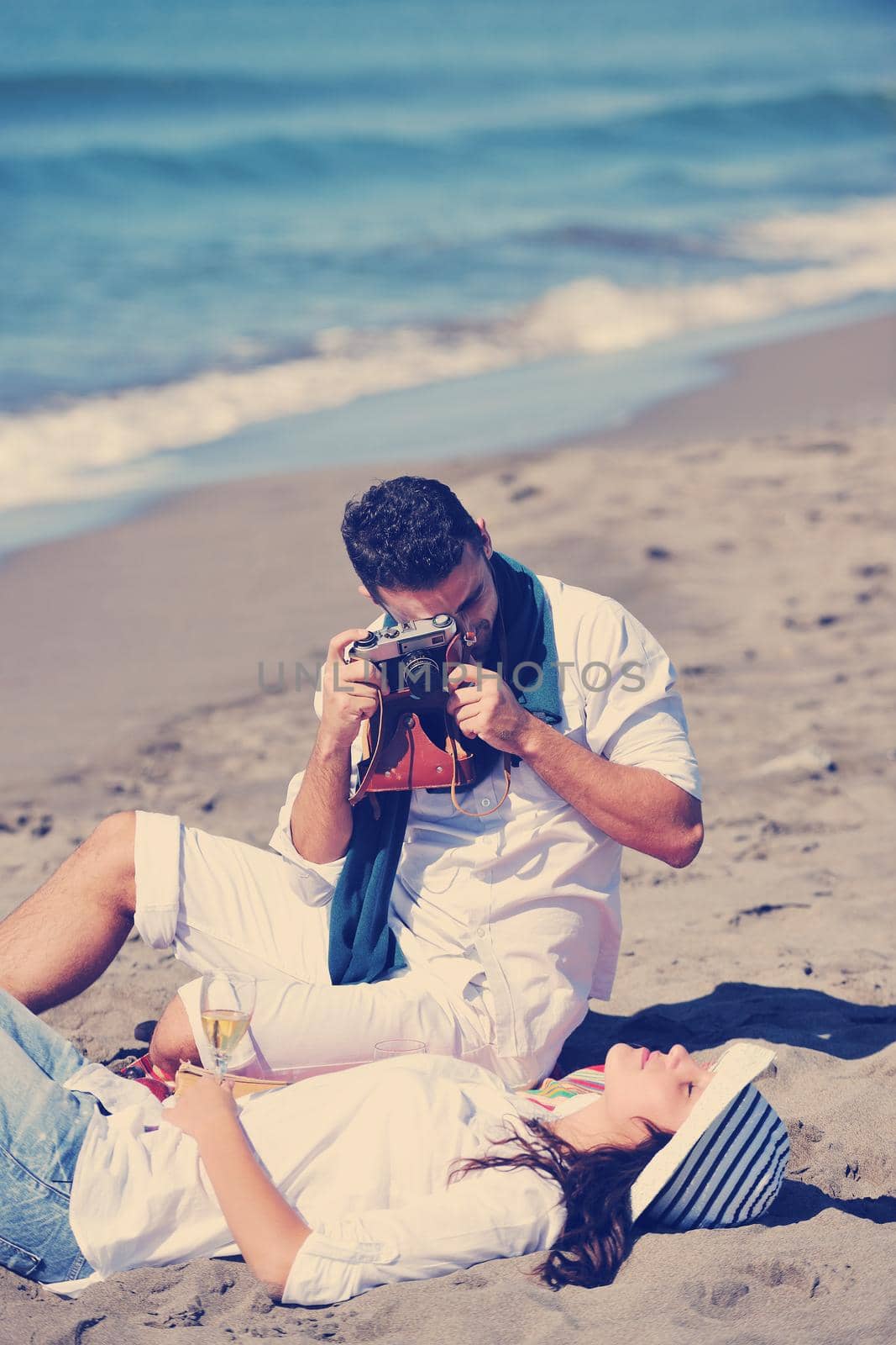 happy young couple relaxing in nature white making photos and taking images and posing for camera