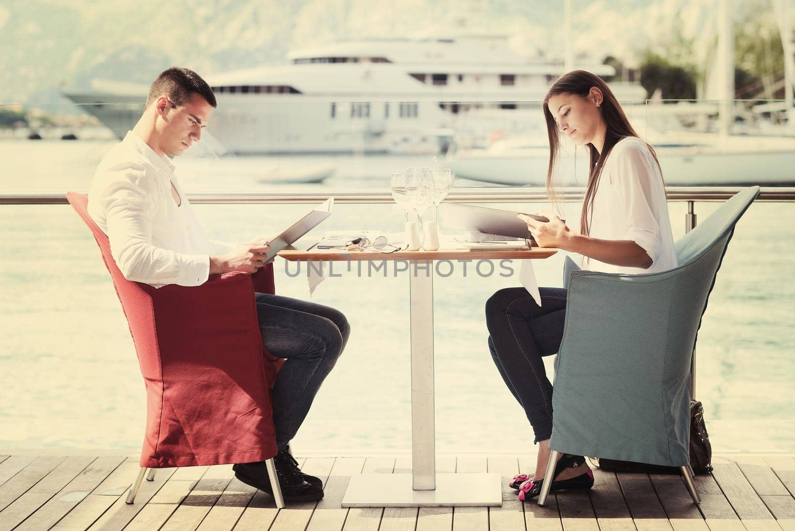 couple having lanch at beautiful restaurant by dotshock