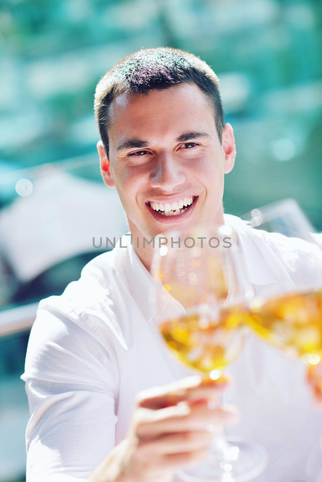 happy young couple having lanch at beautiful restaurant on the beach