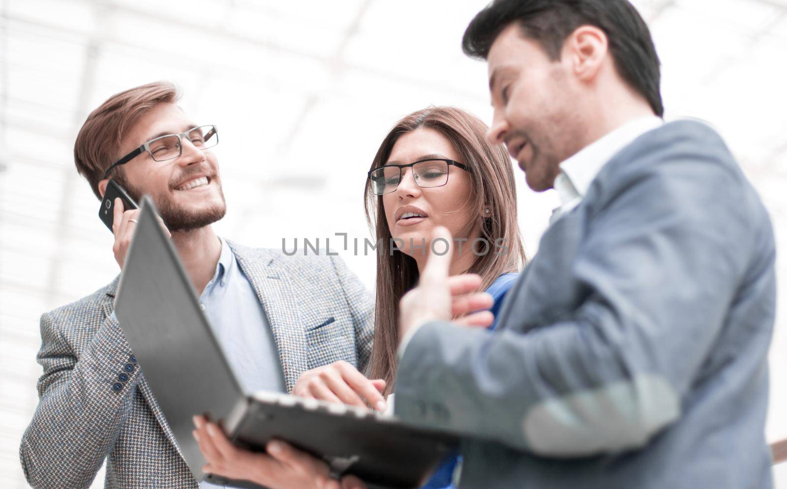 close up.business colleagues using gadgets. people and technology