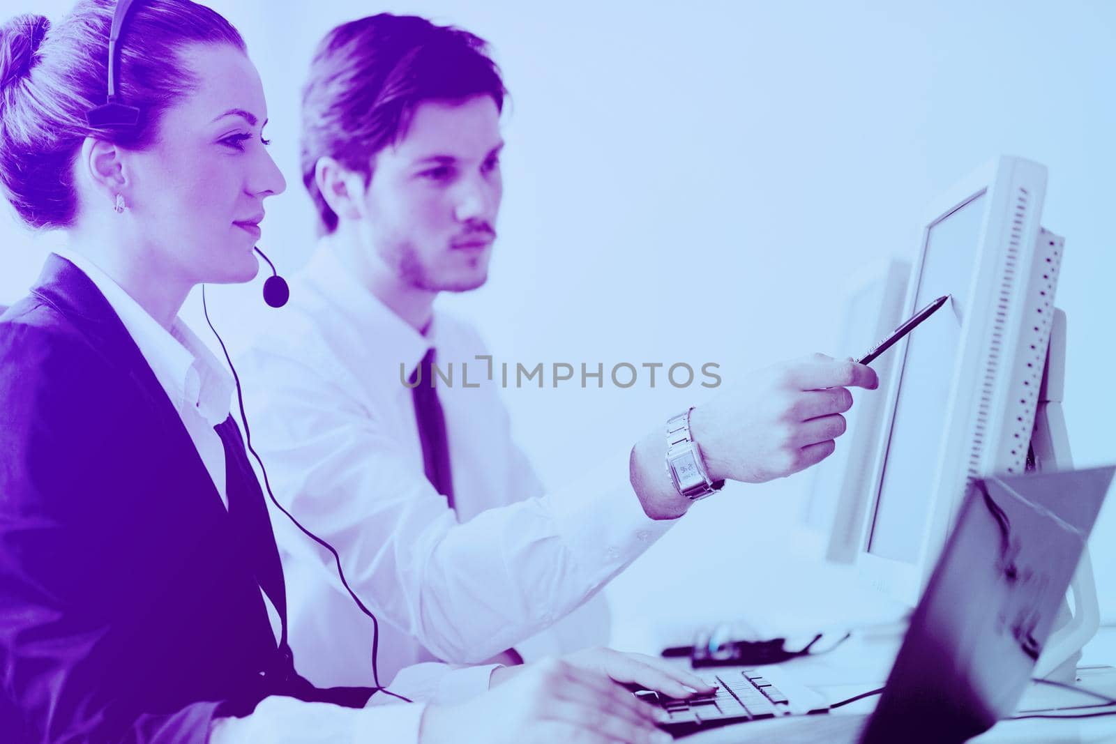 business people group working in customer and helpdesk office by dotshock