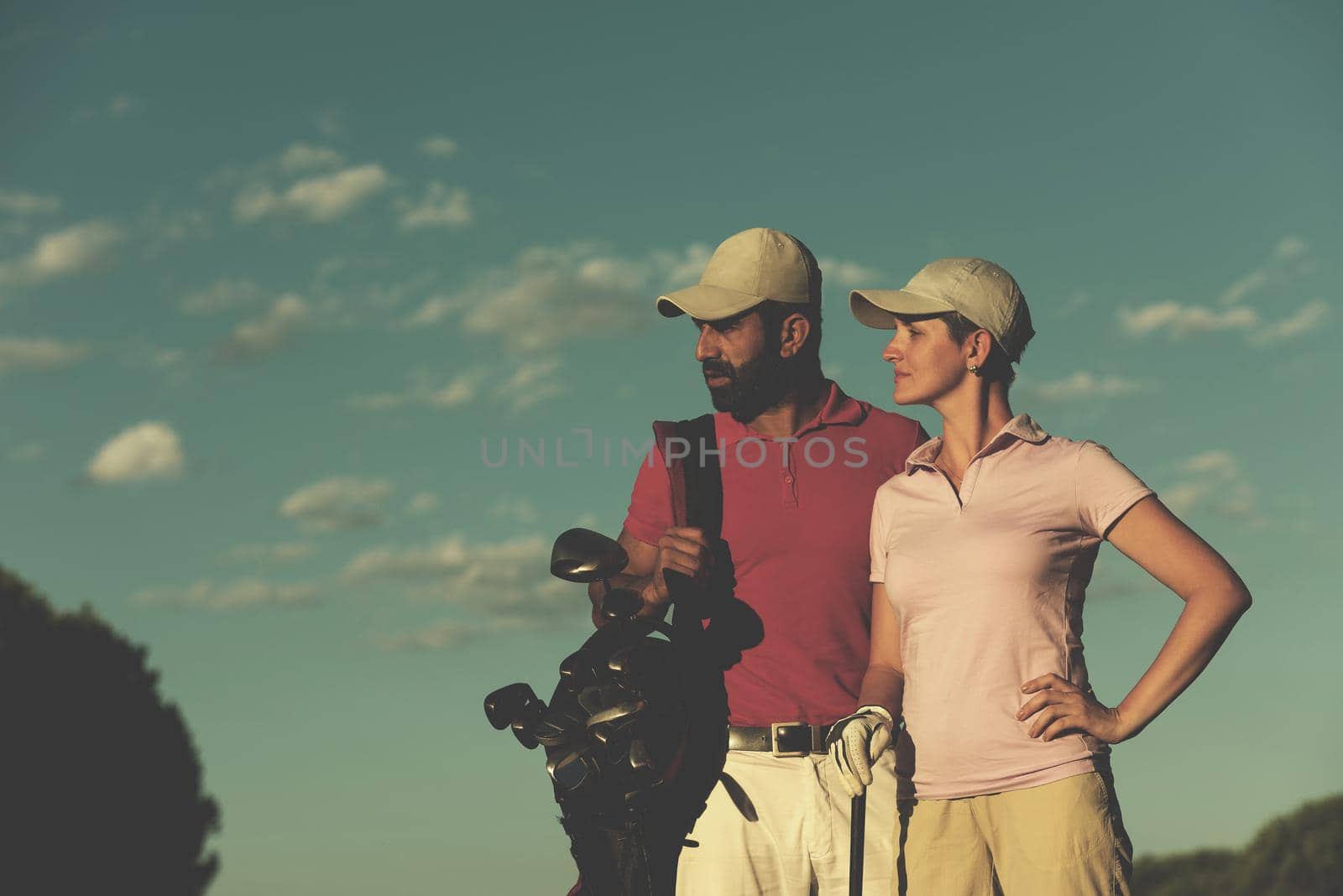 portrait of happy young  couple on golf course