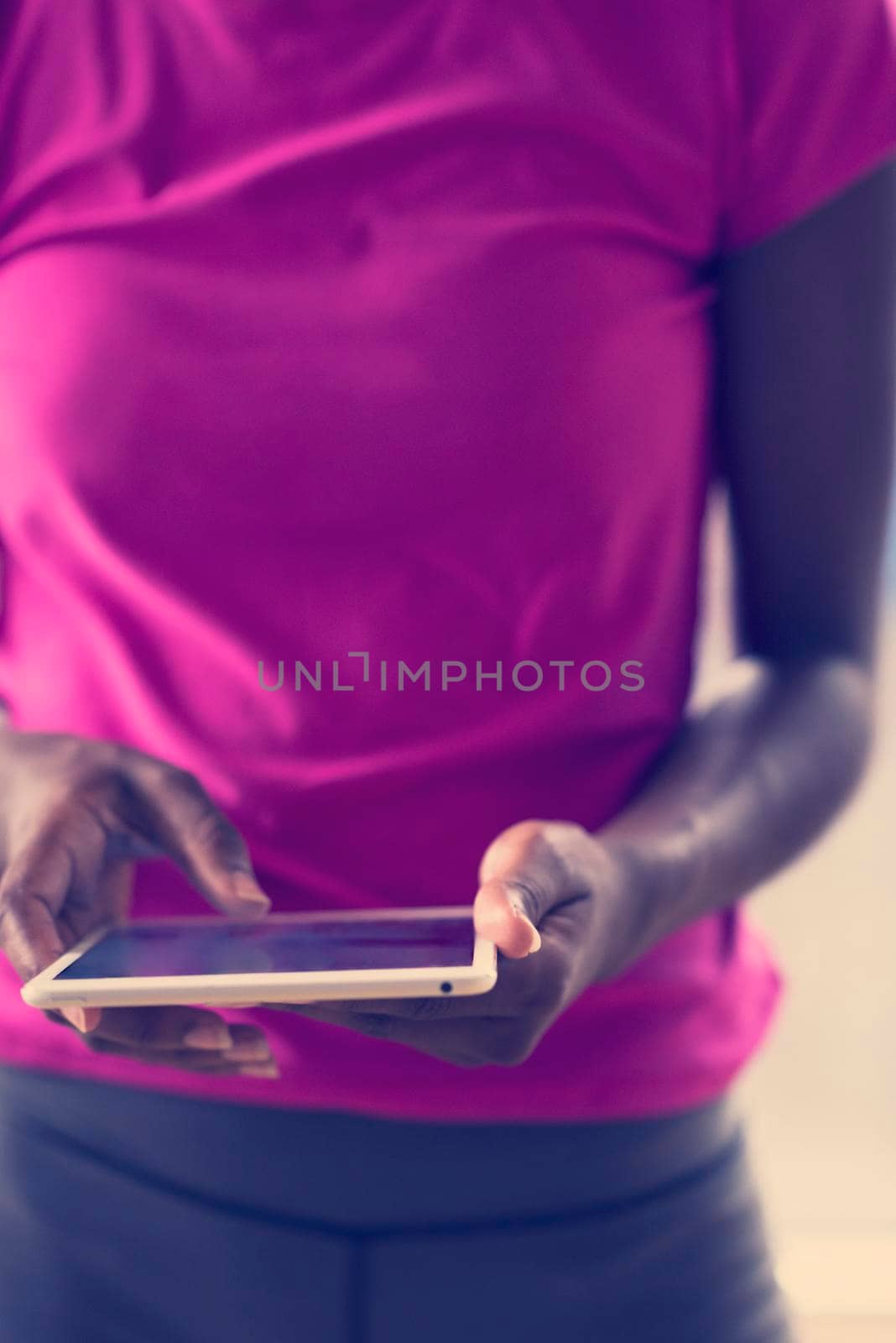 african american woman using tablet by dotshock