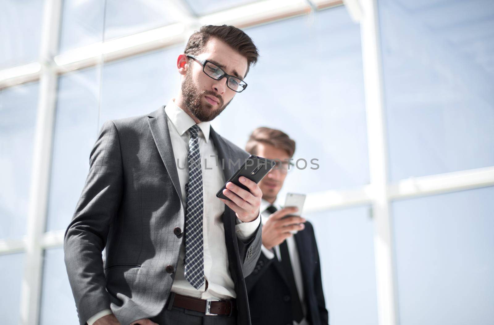 two business people with smartphones.photo with copy space