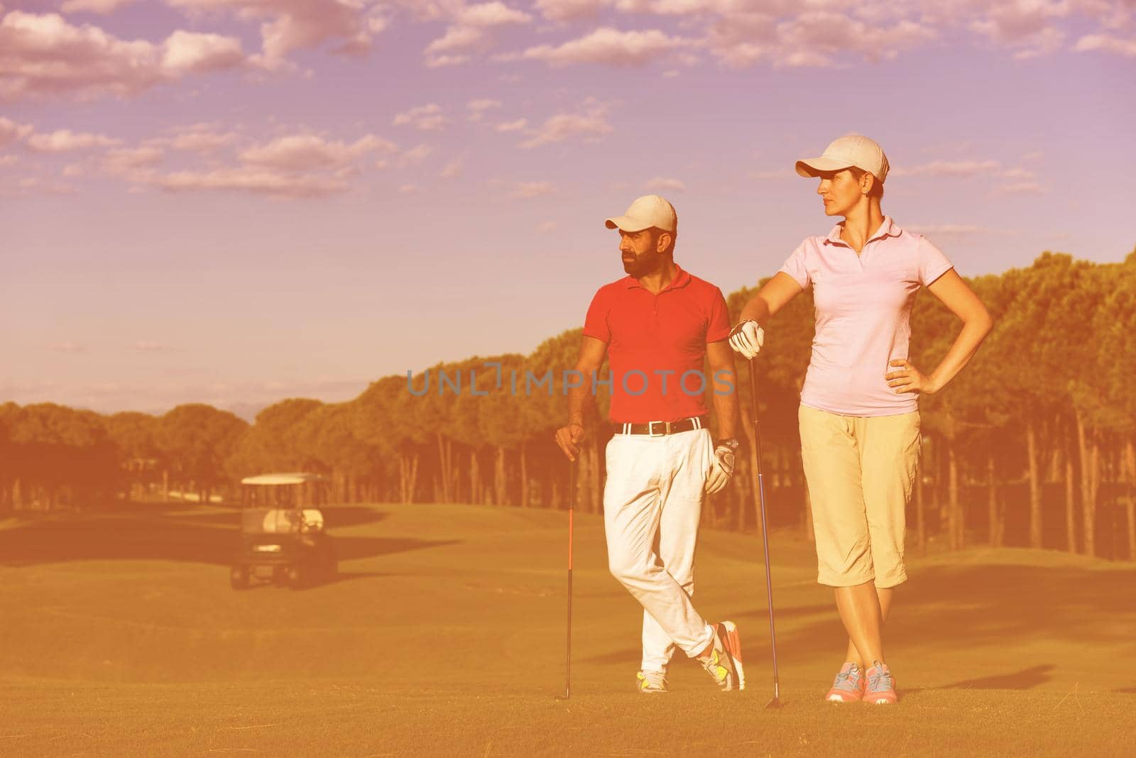 portrait of happy young  couple on golf course