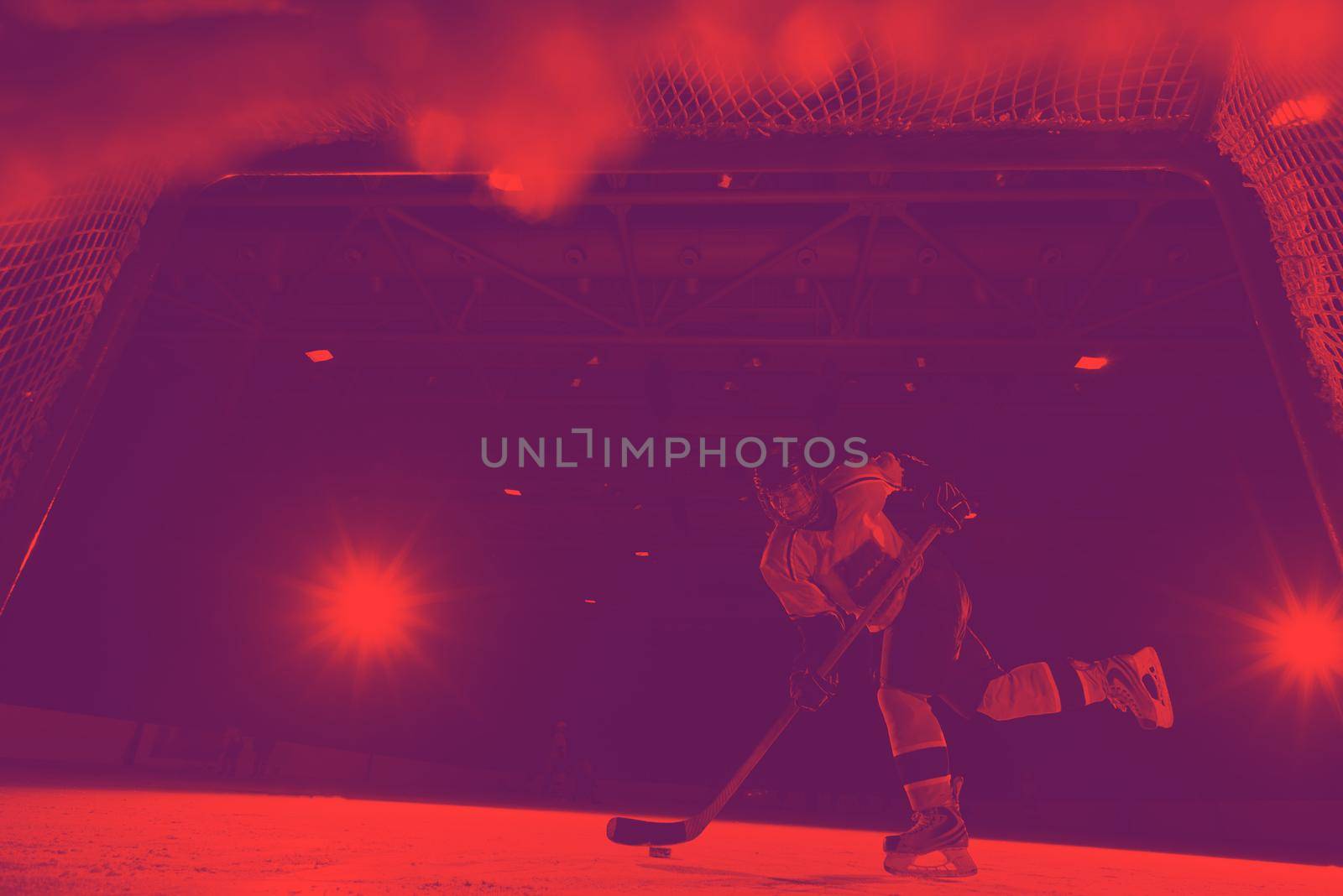 teen girl children ice hockey player in action kicking puck with stick