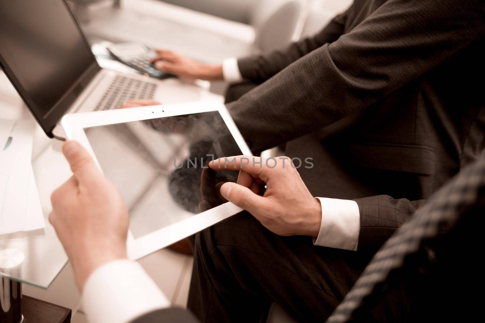 close up.businessman using digital tablet in office.people and technology