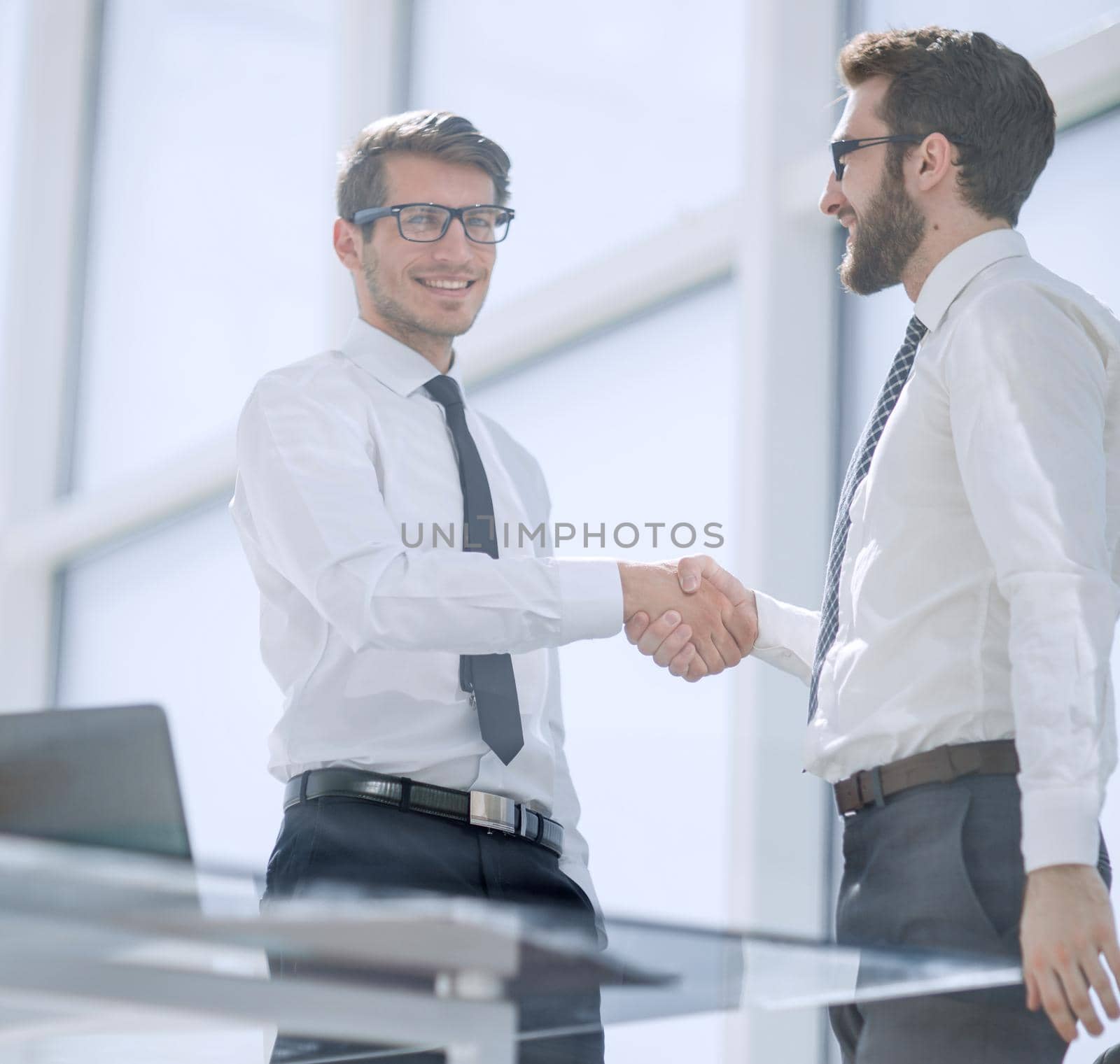 Good work! friendly handshake of business colleagues