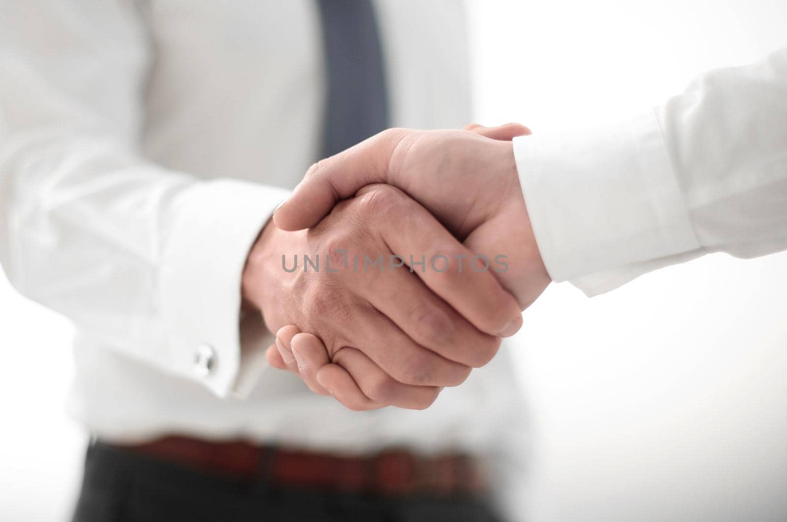 close up.handshake business people. by asdf