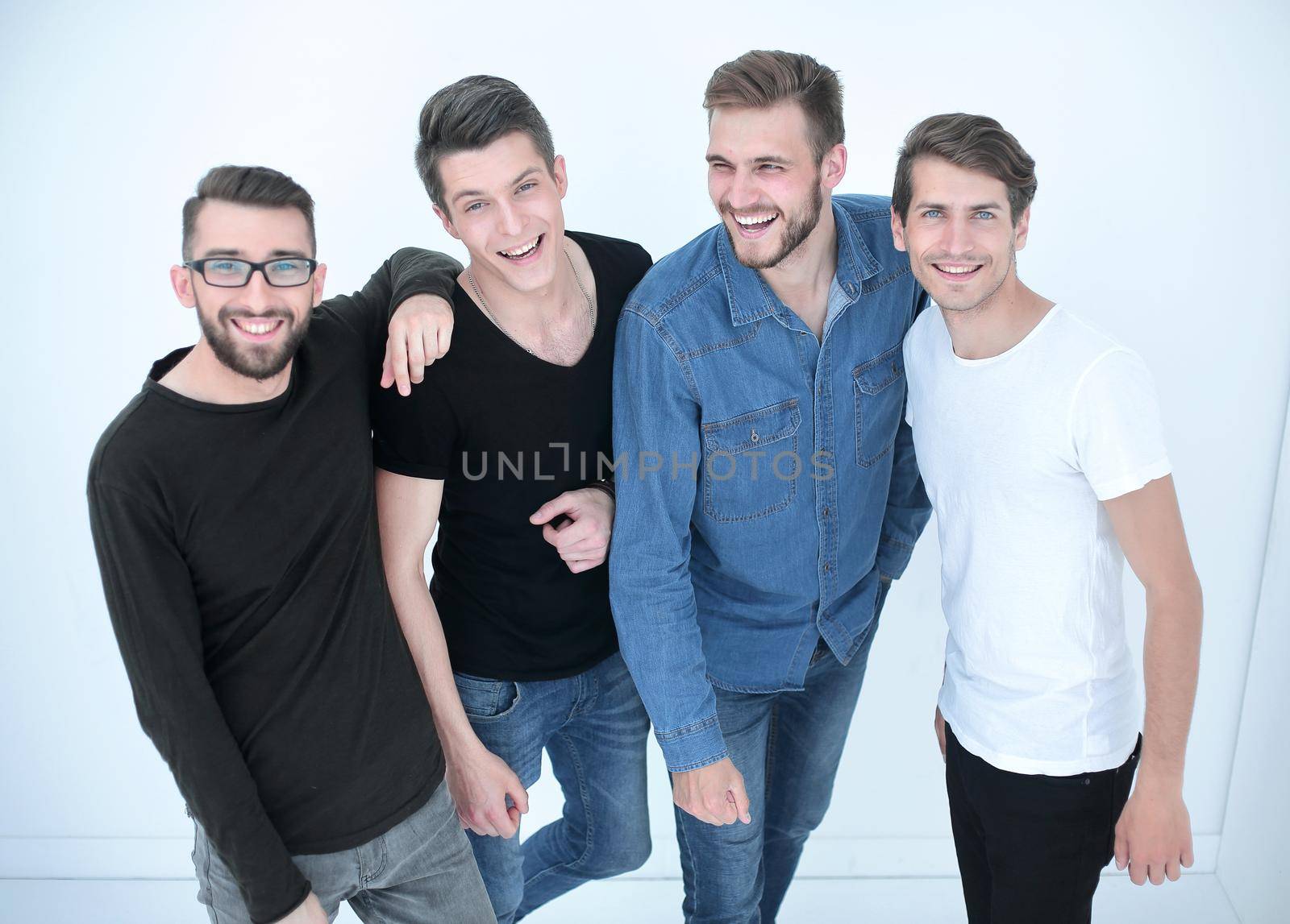 top view..a group of happy young men looking at the camera.isolated on white