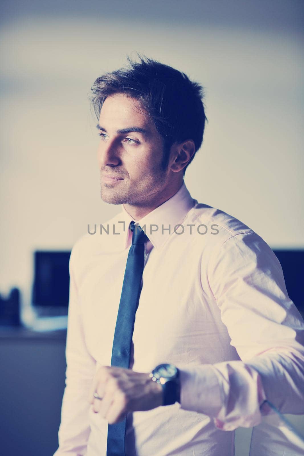 portrait of one young business man at bright office indoor