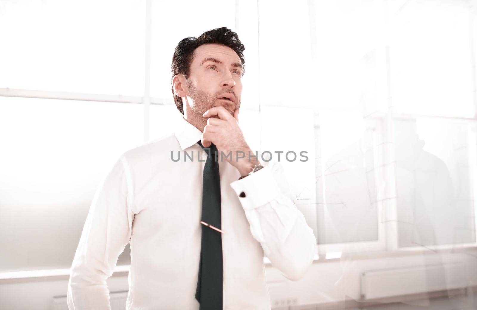 dreaming businessman standing in the office.business concept