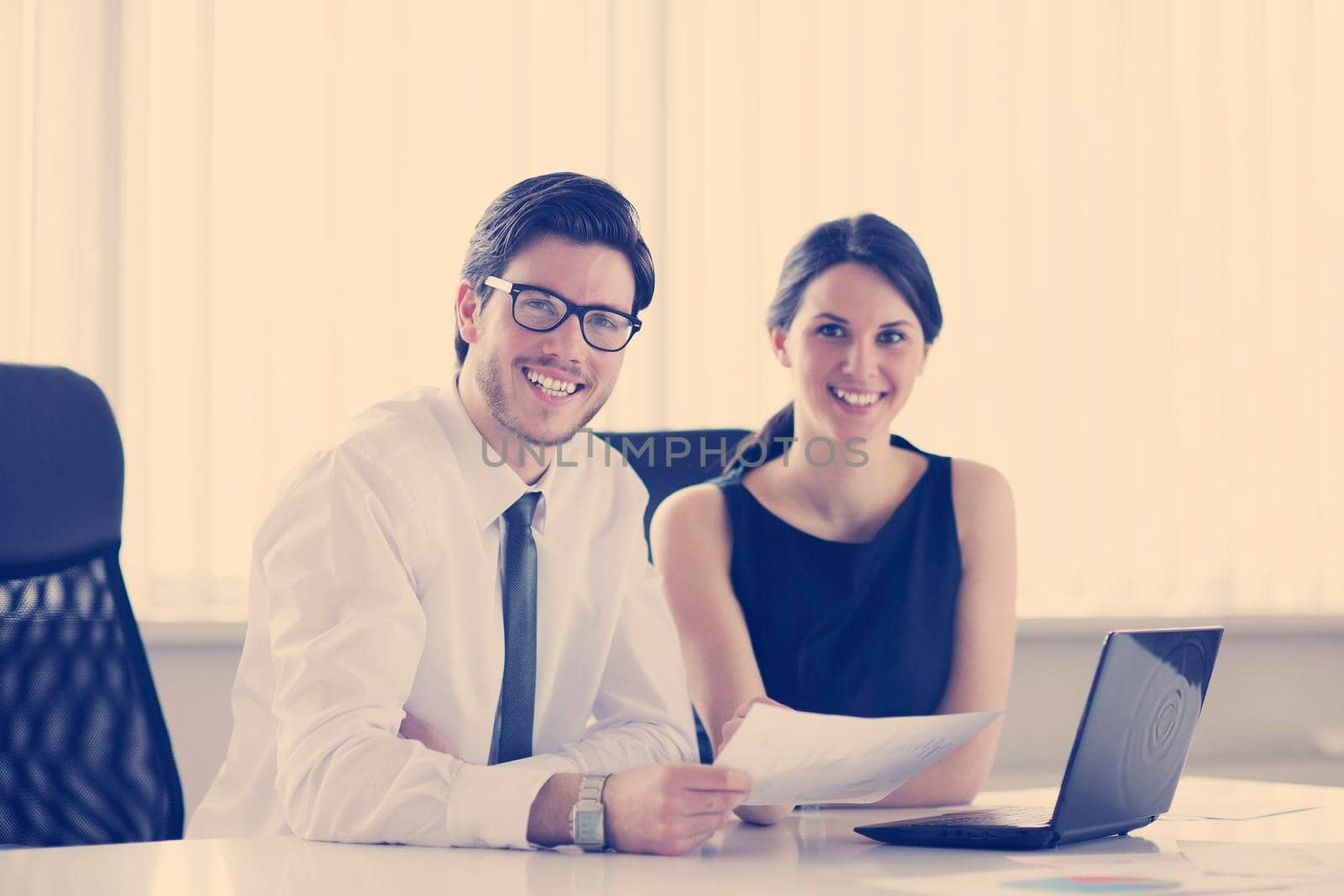 Group of happy young  business people in a meeting at office