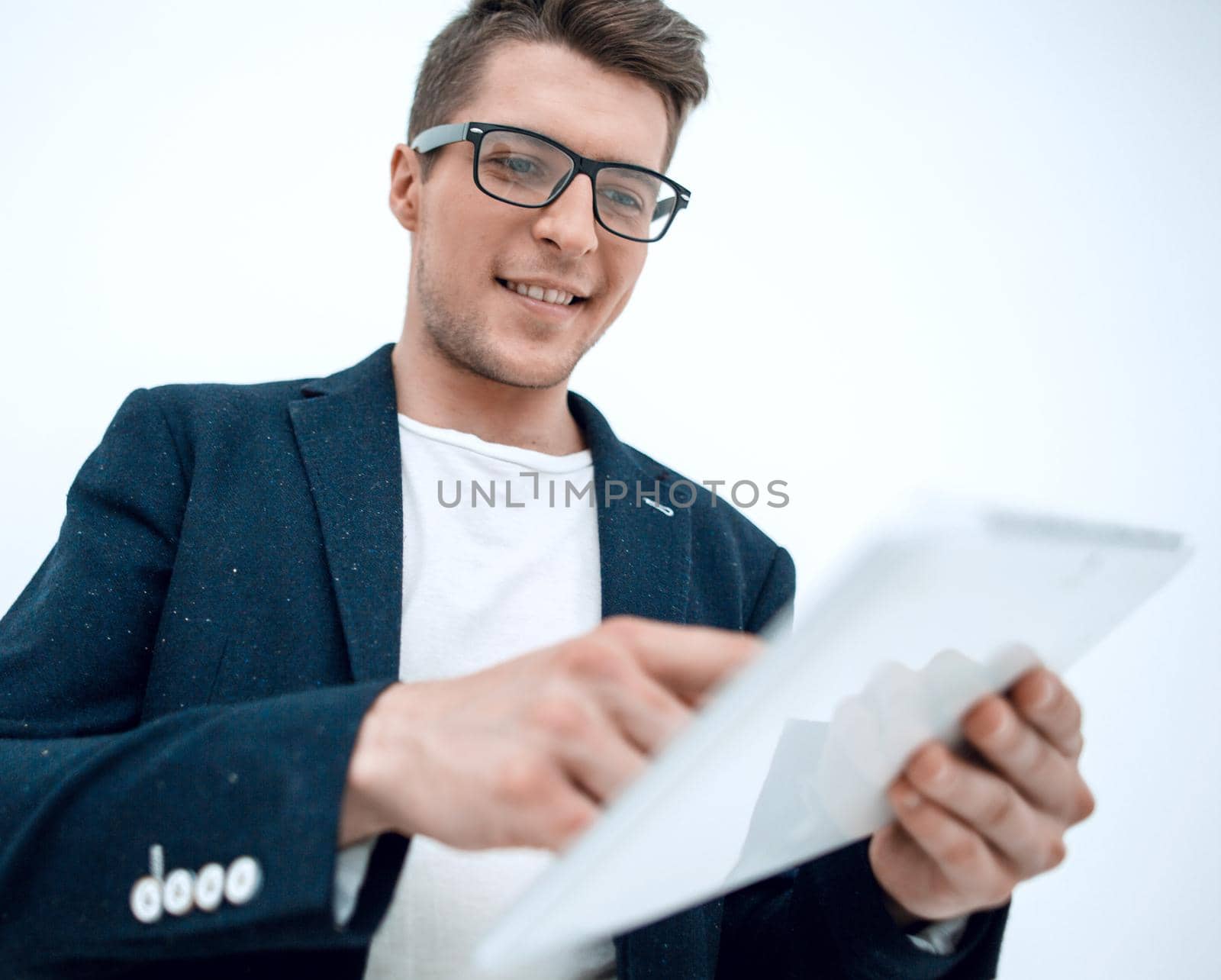close up.successful young businessman using digital tablet.isolated on light background
