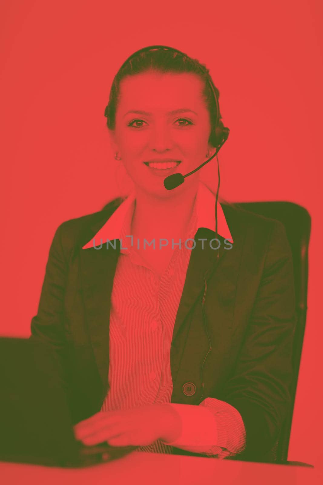 Pretty young business woman group with headphones smiling at you against white background