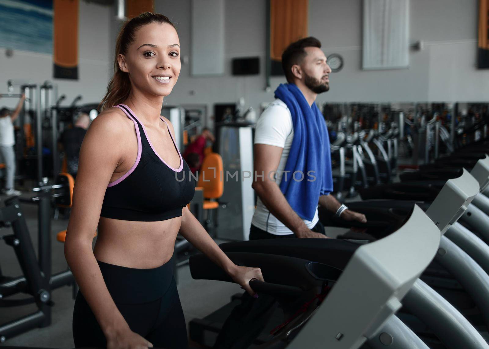 young people working at the gym in the sports centre by asdf