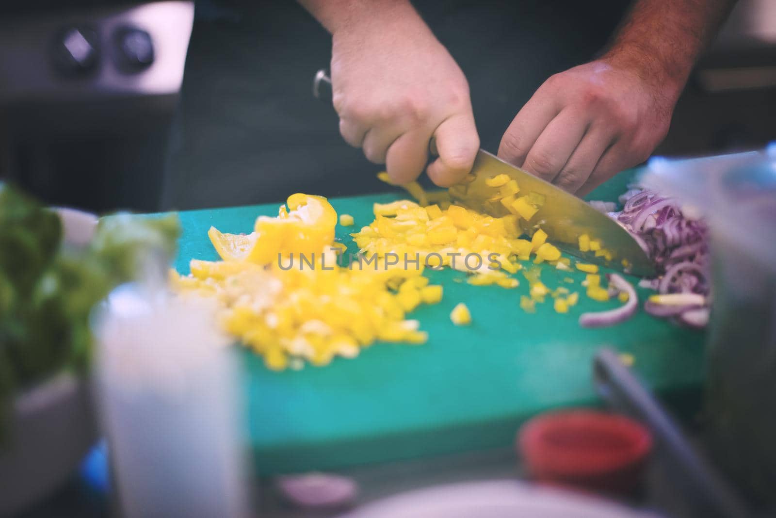 Chef hands cutting fresh and delicious vegetables for cooking or salad