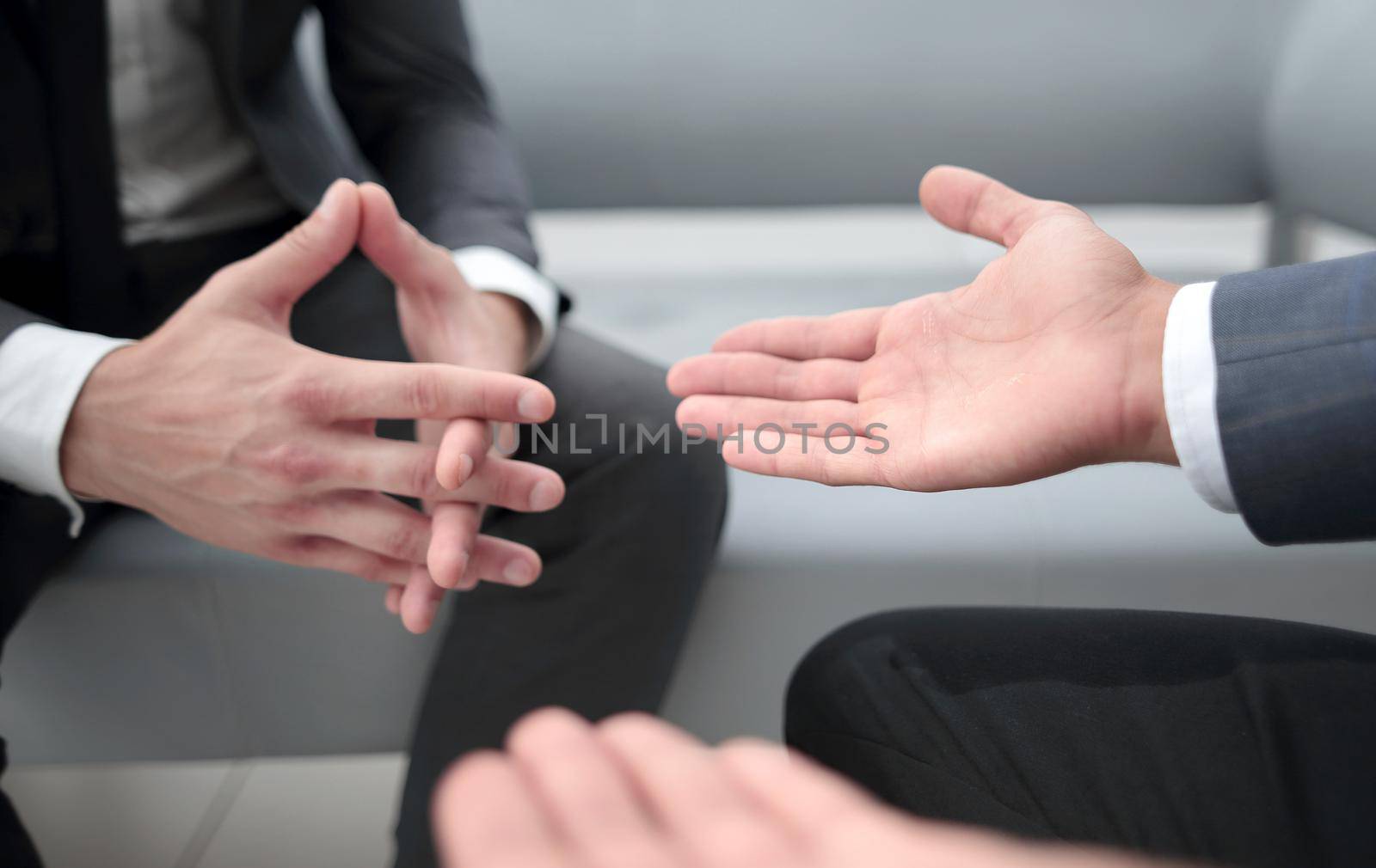 Close up of hands gesturing while.Isolated in office by asdf