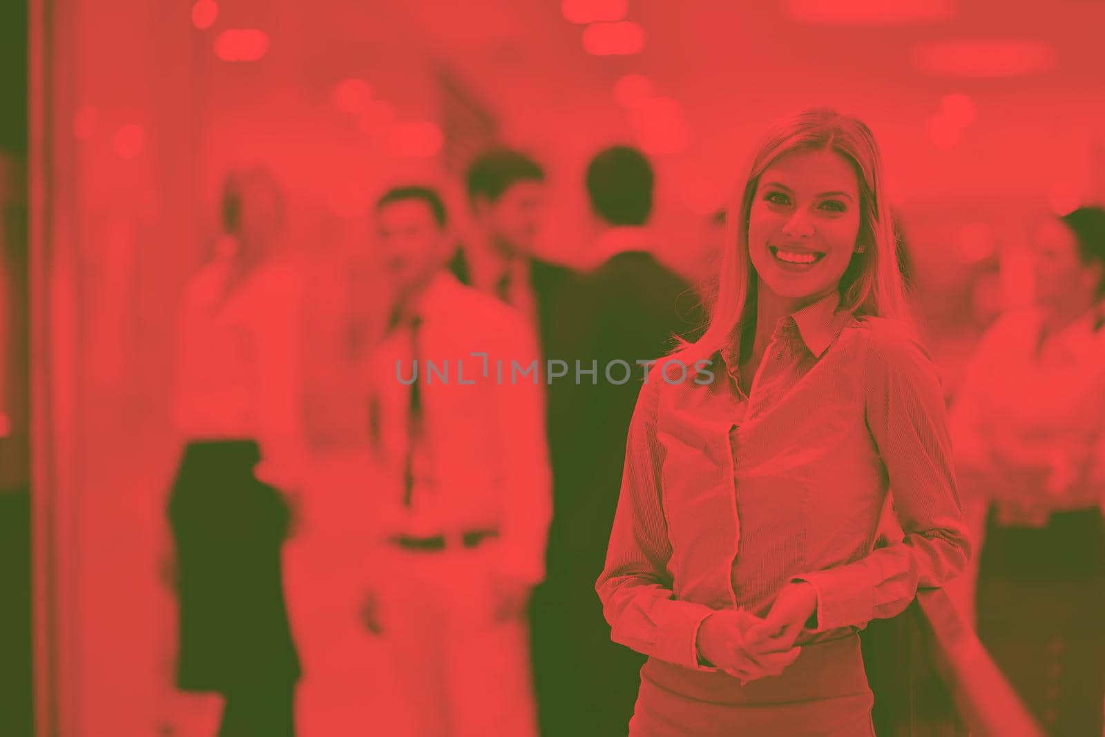 business woman with her staff in background at office by dotshock