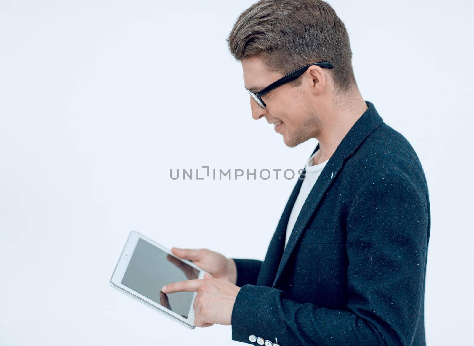 side view.young businessman using digital tablet by asdf