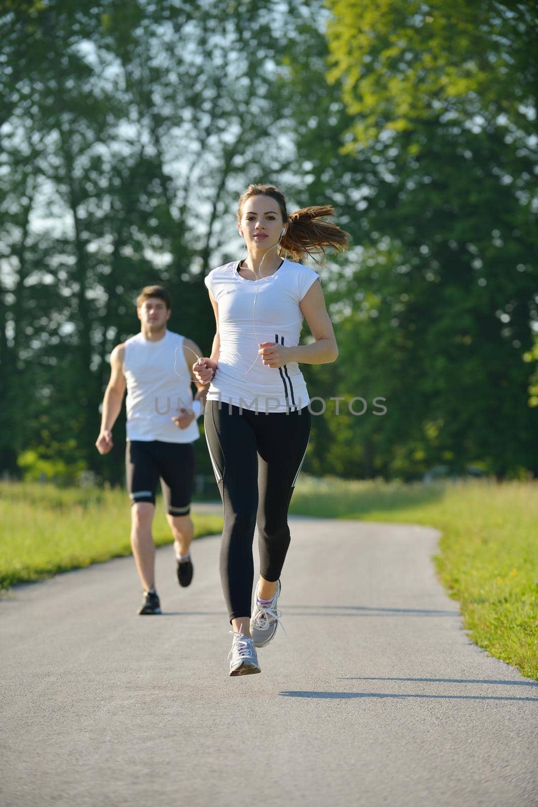 Young couple jogging at morning by dotshock