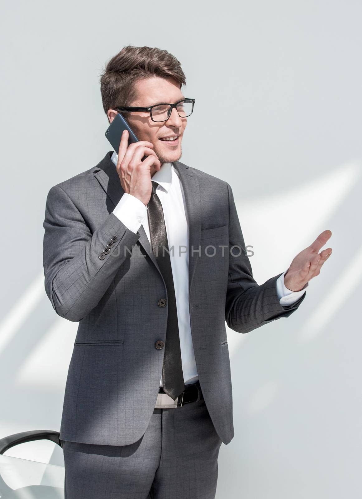 close up.modern businessman talking on the phone. by asdf