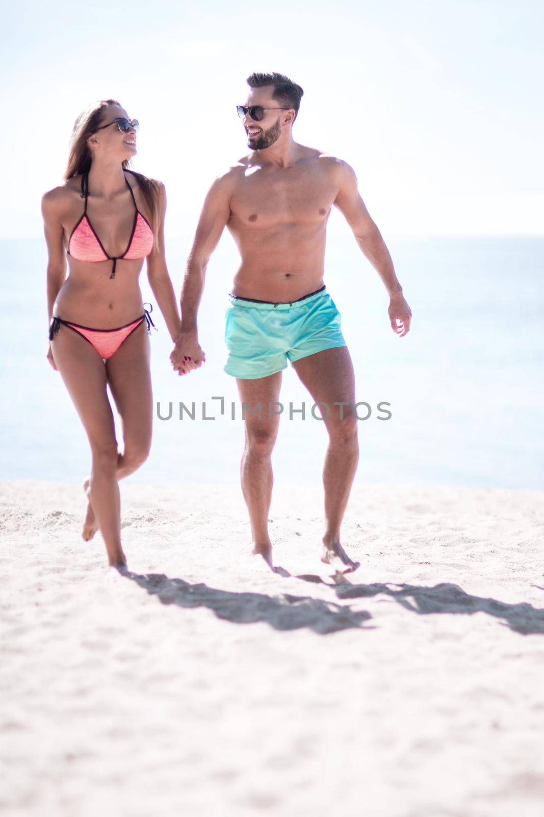 Picture of happy couple on the beach. by asdf