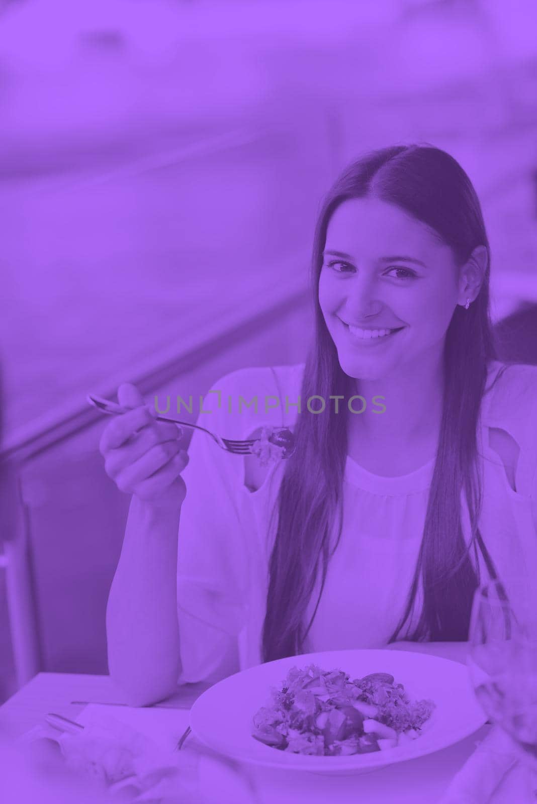 happy young couple having lanch at beautiful restaurant on by the sea on  beach