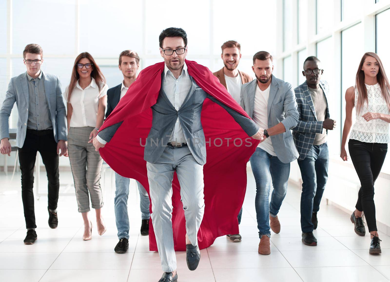 businessman in a red cloak heads the business team by asdf