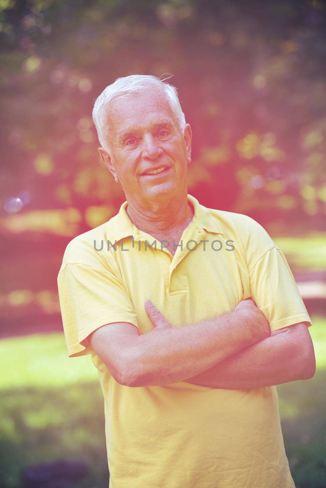 happy grandfather and child have fun and play in park