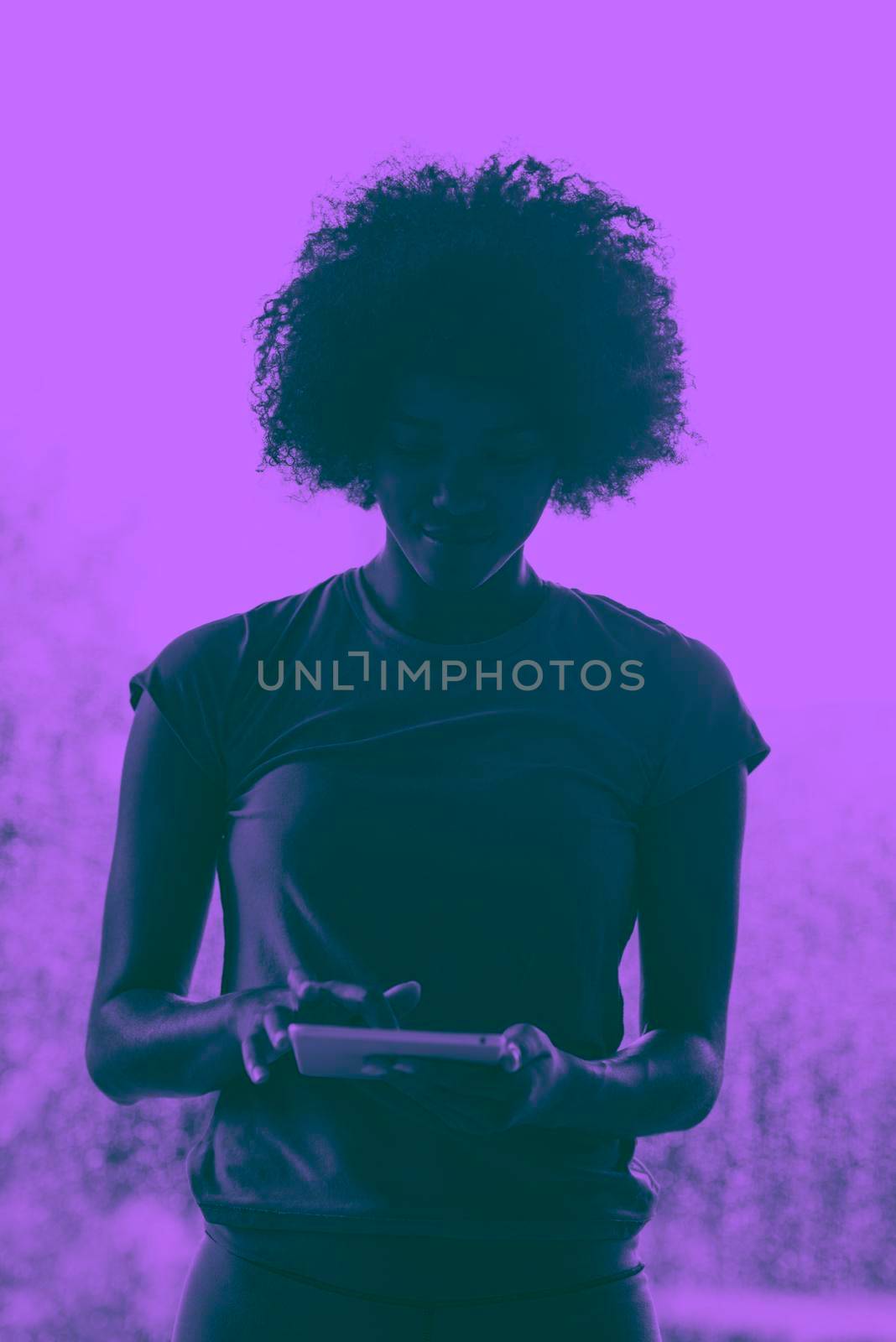 african american woman using tablet by dotshock