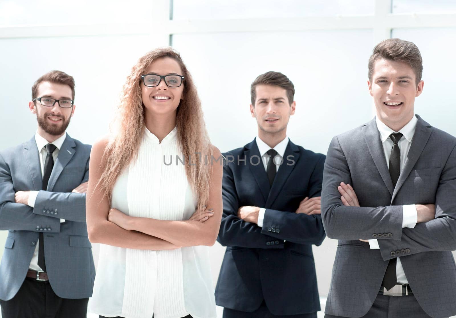 group of confident business people standing in the office. by asdf